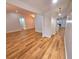 Open-concept living room with wood-look floors and neutral paint at 3146 Byington Terrace Ter, Deltona, FL 32738