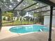 Screened-in pool features an attached hot tub and a spacious outdoor area with view of the backyard at 3146 Byington Terrace Ter, Deltona, FL 32738