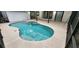 In-ground pool area is encased within a screened enclosure and features a spa with steps at 3146 Byington Terrace Ter, Deltona, FL 32738