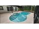 Enclosed in-ground pool has a step-down hot tub and a spacious patio area at 3146 Byington Terrace Ter, Deltona, FL 32738