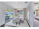 Bright dining area features sliding glass doors to the outdoor living space and stylish decor at 3361 Orange Rose Loop, Apopka, FL 32712