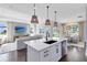 Open-concept kitchen and living room filled with natural light and modern finishes at 3361 Orange Rose Loop, Apopka, FL 32712