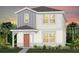 Charming two-story home with gray and white exterior and well-manicured lawn, complemented by lush tropical landscaping at 3363 Vine Leaf St, Apopka, FL 32712