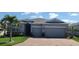 Charming single-story home featuring a well-manicured lawn, two-car garage, and brick driveway at 3986 Bedford Ave, Winter Haven, FL 33884