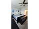 Comfortable main bedroom with soft blue walls and ensuite bathroom access at 3986 Bedford Ave, Winter Haven, FL 33884