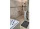 Spacious tiled shower with glass enclosure and a separate soaking tub at 3986 Bedford Ave, Winter Haven, FL 33884