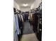 Large walk-in closet fully stocked with clothing and ample storage space at 3986 Bedford Ave, Winter Haven, FL 33884