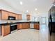 Bright kitchen featuring stainless steel appliances, ample counter space and tile flooring at 404 Wilshire Dr, Casselberry, FL 32707