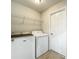 Laundry room featuring a washer, dryer, and wire rack shelving for storage at 404 Wilshire Dr, Casselberry, FL 32707
