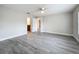 Serene main bedroom with gray floors and a view to the main bathroom at 404 Wilshire Dr, Casselberry, FL 32707