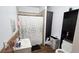 Cozy bathroom featuring a shower with patterned curtain and storage at 412 Bay Nw St, Fort Meade, FL 33841