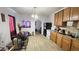 Inviting eat-in kitchen featuring wood cabinets and modern flooring at 412 Bay Nw St, Fort Meade, FL 33841