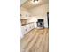 Well-lit kitchen featuring white cabinets, wood countertop, and modern appliances at 412 Bay Nw St, Fort Meade, FL 33841