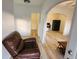 Inviting interior with wood-look floors, archway, and comfortable seating area at 412 Bay Nw St, Fort Meade, FL 33841