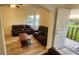 Comfortable living area with wood-look floors, neutral walls, and great natural light at 412 Bay Nw St, Fort Meade, FL 33841