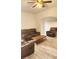 Inviting living room featuring wood-look floors and comfortable leather seating at 412 Bay Nw St, Fort Meade, FL 33841