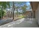 Spacious backyard featuring mature trees, outdoor seating area, a patio, and a fenced perimeter at 4161 Leafy Glade Pl, Casselberry, FL 32707