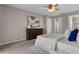 Bright bedroom featuring dark wood dresser and walk-in closet at 4161 Leafy Glade Pl, Casselberry, FL 32707