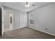 Bedroom featuring neutral walls, carpet, closet, and natural light from a window at 4161 Leafy Glade Pl, Casselberry, FL 32707