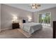 Bedroom featuring a large window and light colored carpet at 4161 Leafy Glade Pl, Casselberry, FL 32707