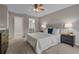 Comfortable carpeted bedroom with ensuite bathroom and ample closet space at 4161 Leafy Glade Pl, Casselberry, FL 32707