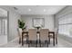Bright dining area with seating for four, neutral tones, and a serene ambiance at 4161 Leafy Glade Pl, Casselberry, FL 32707