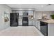 Spacious kitchen featuring light-colored cabinets, black appliances, and a functional layout at 4161 Leafy Glade Pl, Casselberry, FL 32707