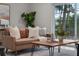 Comfortable living room featuring a plush sofa, stylish coffee table, and natural light at 4161 Leafy Glade Pl, Casselberry, FL 32707