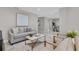 Open concept living area showcases tile floors, a comfortable sofa, and contemporary decor at 4161 Leafy Glade Pl, Casselberry, FL 32707