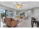 Relaxing living space with sliding glass doors, a comfortable sofa, and contemporary decor at 4161 Leafy Glade Pl, Casselberry, FL 32707