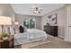 Cozy main bedroom with carpeted floor, dresser, and a sliding glass door to backyard at 4161 Leafy Glade Pl, Casselberry, FL 32707