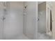 Tiled walk-in shower with chrome hardware and a built-in shower bench at 4161 Leafy Glade Pl, Casselberry, FL 32707