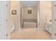 Spacious bathroom featuring tiled floors, double vanities, and a luxurious soaking tub for relaxation at 426 Vista Loop, Davenport, FL 33897