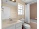 Well-lit bathroom with a single vanity, toilet, bathtub, and shower behind a curtain at 426 Vista Loop, Davenport, FL 33897