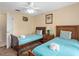 Bedroom with two twin beds and ceiling fan, perfect for a Gathering at 426 Vista Loop, Davenport, FL 33897