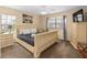 A cozy bedroom with neutral tones, carpet, and a luxurious, decorative bedframe at 426 Vista Loop, Davenport, FL 33897