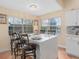 Bright kitchen featuring a large island with bar seating and light fixtures at 426 Vista Loop, Davenport, FL 33897