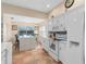 Bright eat-in kitchen with an island, quartz countertops, and stainless steel appliances at 426 Vista Loop, Davenport, FL 33897