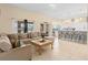 Spacious living room open to the kitchen with tile flooring and contemporary furnishings at 426 Vista Loop, Davenport, FL 33897