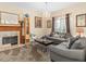 Comfortable living room with a fireplace, chandelier, and plush seating at 426 Vista Loop, Davenport, FL 33897
