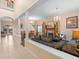 Open-concept living and dining area with lots of natural light, carpet and tile at 426 Vista Loop, Davenport, FL 33897