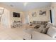 Living room with neutral color palette and ample natural light at 426 Vista Loop, Davenport, FL 33897