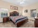 Warm and inviting main bedroom featuring carpet and traditional furnishings at 426 Vista Loop, Davenport, FL 33897