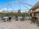 Outdoor patio featuring a table with chairs, an umbrella swing, and a privacy screen at 426 Vista Loop, Davenport, FL 33897