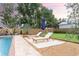 Beautiful backyard with pool, water features, lounge chairs and patio area at 446 Piney Croft Ln, Maitland, FL 32751