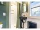 Modern bathroom with open shower featuring brushed gold fixtures and natural light at 446 Piney Croft Ln, Maitland, FL 32751