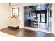 Inviting entryway with dark accent wall and decorative cabinet, leading to an outdoor patio area at 446 Piney Croft Ln, Maitland, FL 32751