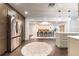Open kitchen flows to the dining area with stainless steel appliances and luxury finishes at 446 Piney Croft Ln, Maitland, FL 32751