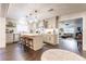 Bright, updated kitchen with white countertops, stainless steel appliances, and bar seating at 446 Piney Croft Ln, Maitland, FL 32751