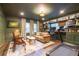 Relaxing living room/office with rich built-ins, desk, and comfortable seating area at 446 Piney Croft Ln, Maitland, FL 32751